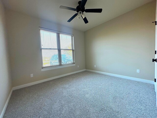 carpeted empty room with ceiling fan