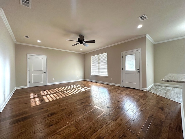 interior space with ceiling fan, dark hardwood / wood-style flooring, and ornamental molding