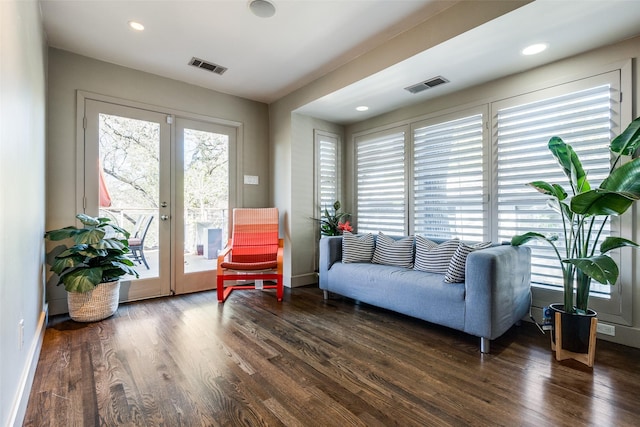 living room featuring french doors and dark hardwood / wood-style flooring