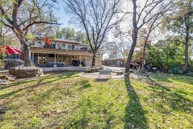 view of yard featuring a patio area and a wooden deck