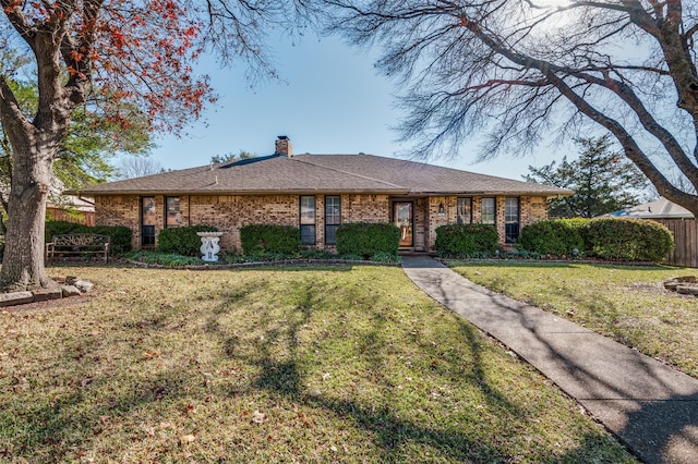 ranch-style home featuring a front yard