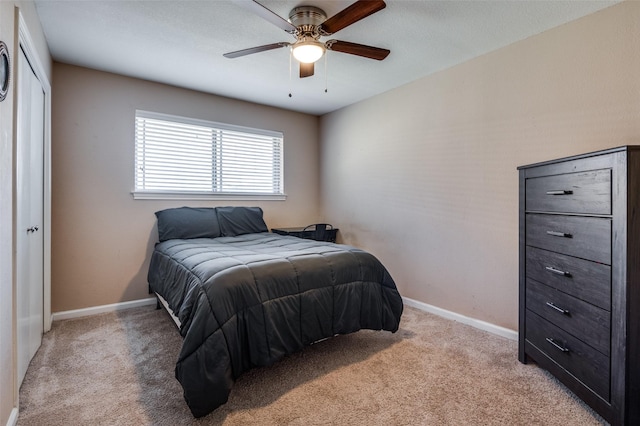 carpeted bedroom featuring ceiling fan