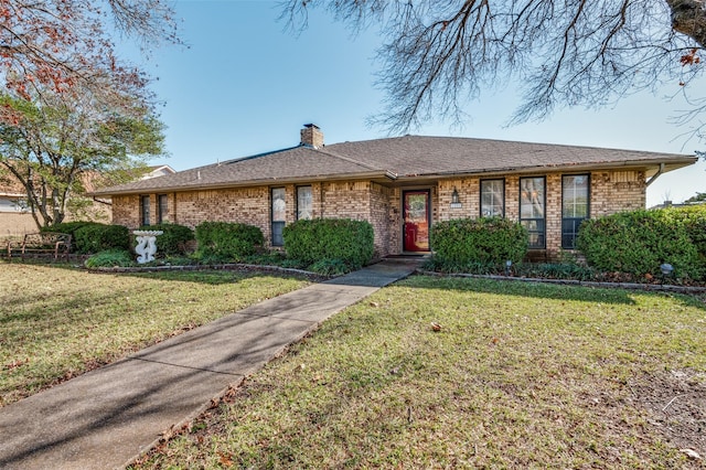 ranch-style home with a front lawn