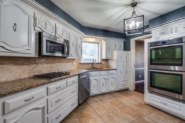 kitchen featuring white cabinets and appliances with stainless steel finishes