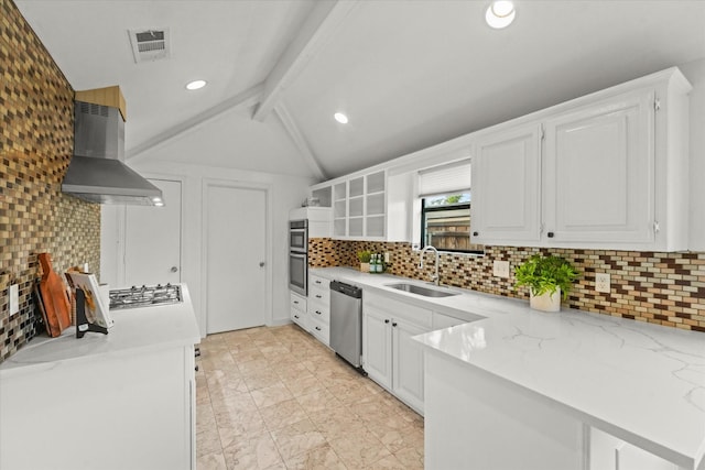 kitchen featuring wall chimney range hood, sink, white cabinetry, kitchen peninsula, and stainless steel appliances