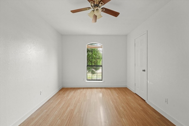 spare room featuring ceiling fan and light hardwood / wood-style flooring