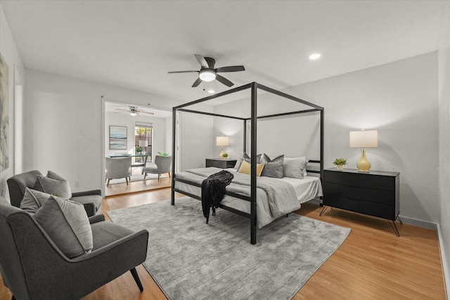 bedroom featuring a ceiling fan, recessed lighting, baseboards, and light wood finished floors