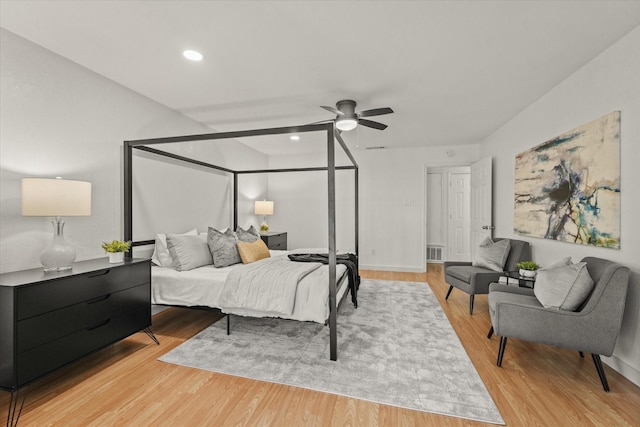 bedroom with recessed lighting, visible vents, ceiling fan, light wood-type flooring, and baseboards