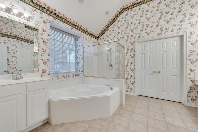 bathroom with vanity, tile patterned flooring, lofted ceiling, and shower with separate bathtub