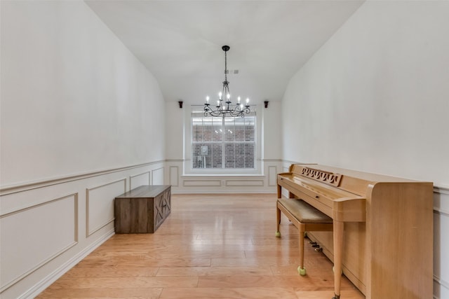 dining area featuring a notable chandelier and light hardwood / wood-style flooring