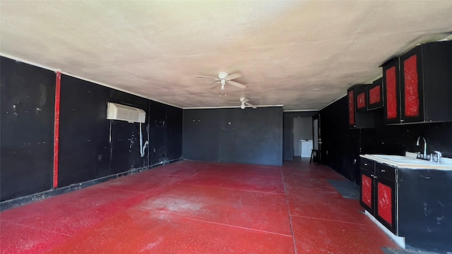 interior space featuring ceiling fan, an AC wall unit, and sink