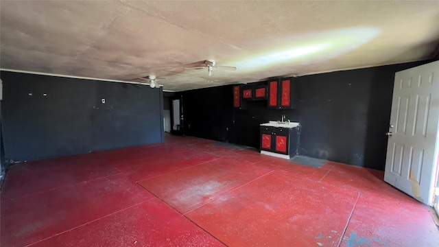 garage with ceiling fan and sink