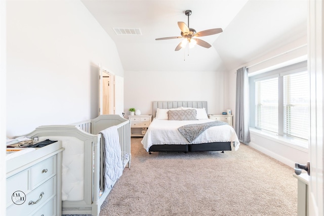 bedroom with carpet, ceiling fan, and vaulted ceiling