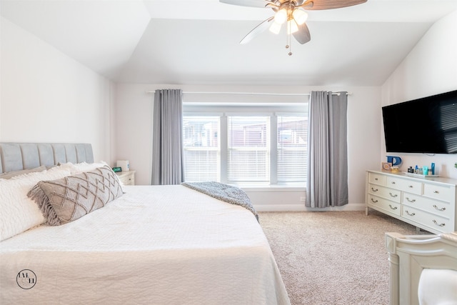 bedroom with ceiling fan, carpet floors, and lofted ceiling