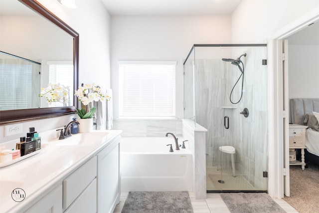 bathroom featuring tile patterned flooring, vanity, and independent shower and bath