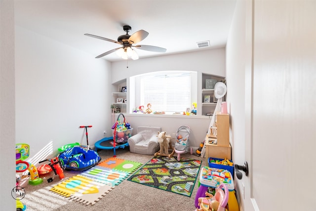 playroom featuring ceiling fan and carpet