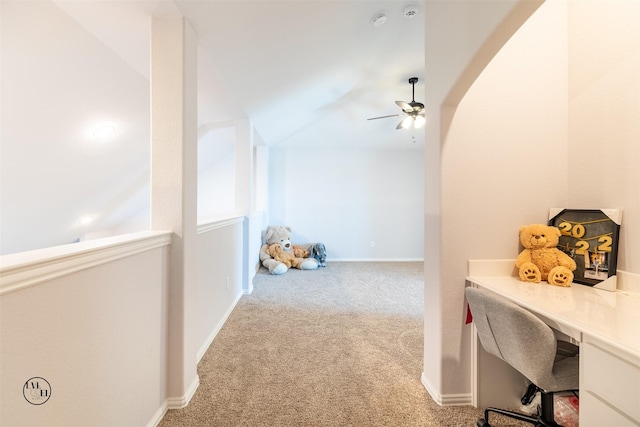 home office with ceiling fan, light colored carpet, and lofted ceiling