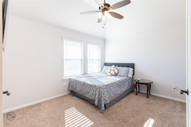 bedroom with ceiling fan and light colored carpet