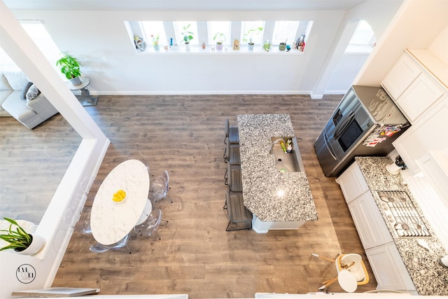 unfurnished living room featuring wood-type flooring