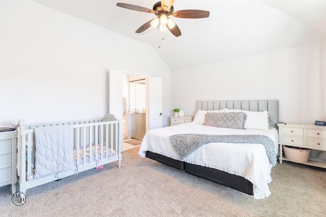 bedroom with ceiling fan, lofted ceiling, and light carpet