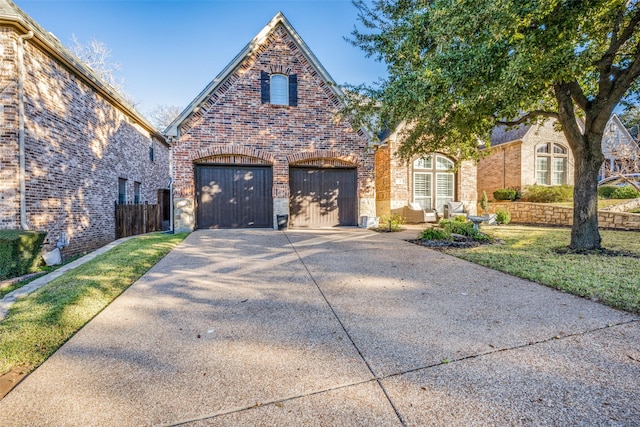 view of front of home with a garage and a front yard