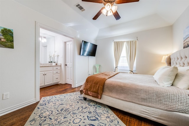 bedroom featuring lofted ceiling, connected bathroom, ceiling fan, and dark wood-type flooring