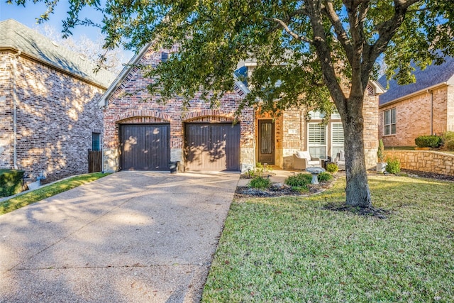 view of front facade with a garage and a front lawn