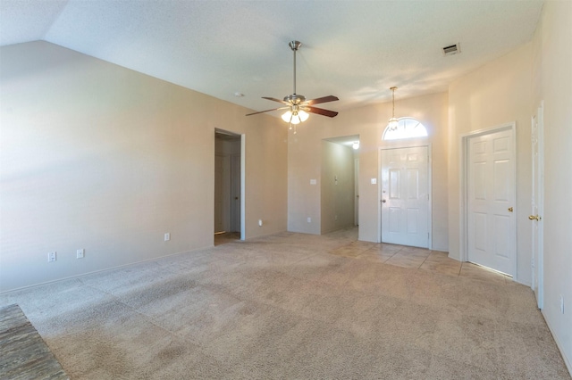 interior space with ceiling fan and lofted ceiling