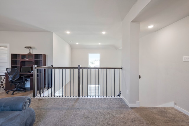 hallway with carpet flooring