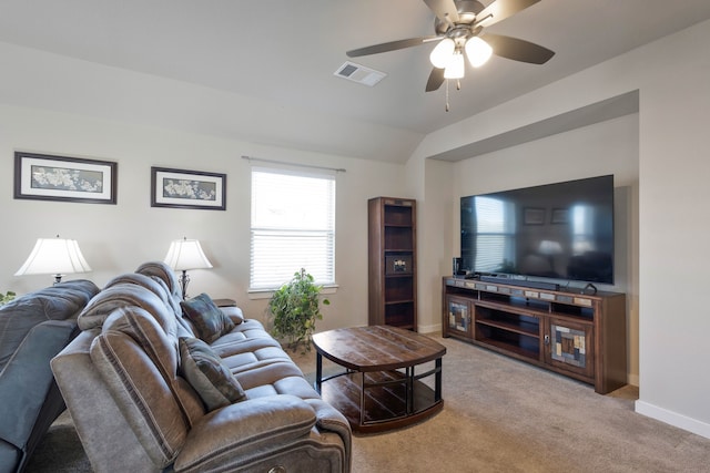 living room with carpet floors, ceiling fan, and lofted ceiling