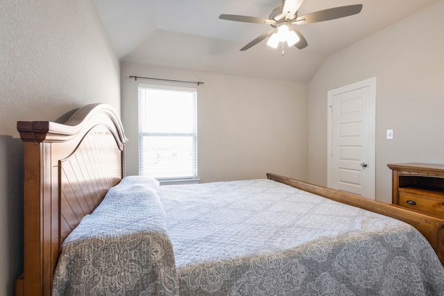 bedroom featuring ceiling fan and vaulted ceiling