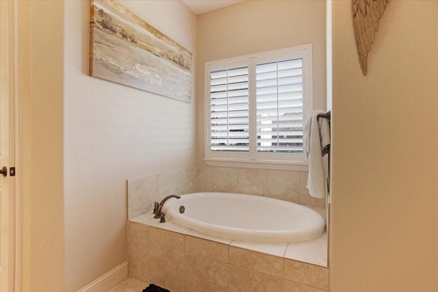 bathroom featuring a relaxing tiled tub