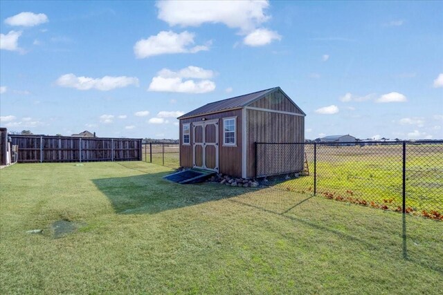 view of outbuilding featuring a yard