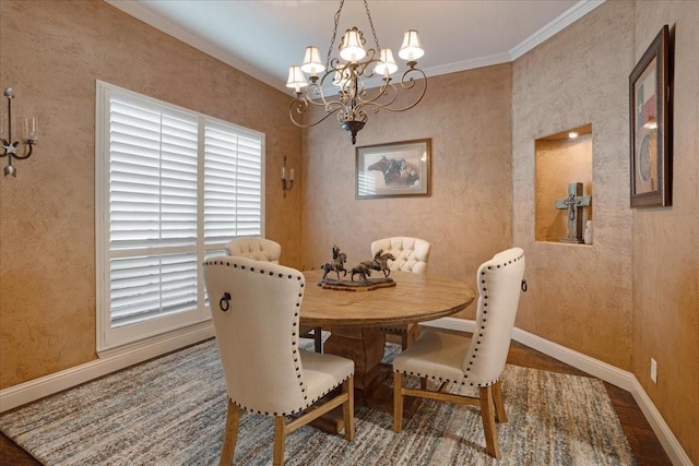 dining area with hardwood / wood-style flooring, an inviting chandelier, and crown molding