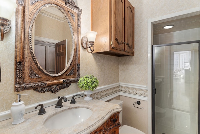 bathroom with vanity, an enclosed shower, and toilet