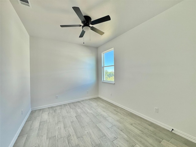 unfurnished room with ceiling fan and light hardwood / wood-style flooring