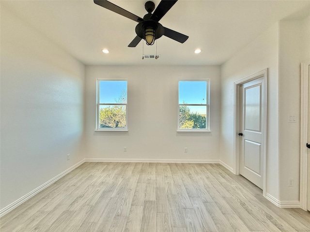 unfurnished room featuring ceiling fan and light hardwood / wood-style flooring