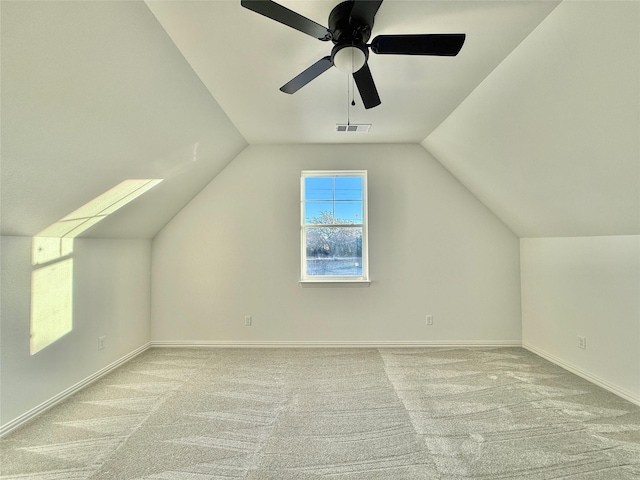 additional living space with light carpet, ceiling fan, and lofted ceiling