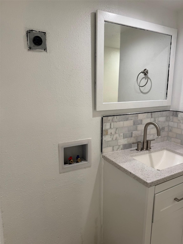 interior space with decorative backsplash and vanity