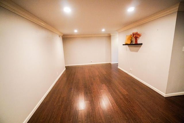 unfurnished room with dark hardwood / wood-style floors and crown molding