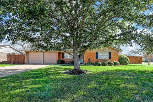 ranch-style house with a garage and a front lawn