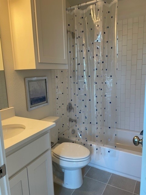 full bathroom featuring tile patterned floors, washtub / shower combination, vanity, and toilet