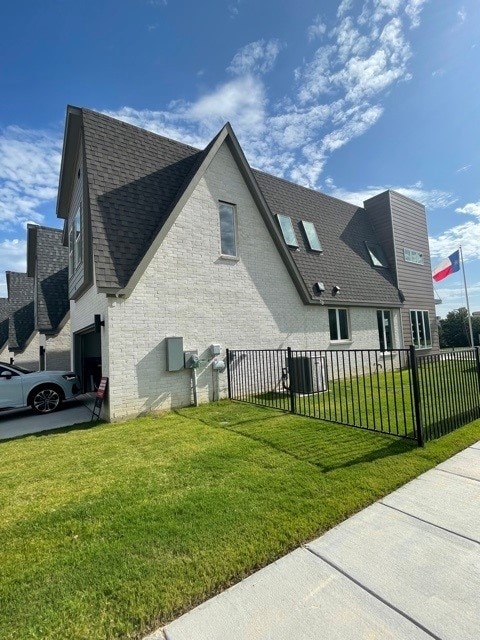 view of home's exterior with a garage and a yard