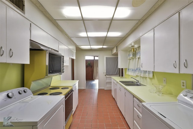 kitchen with washer and clothes dryer, range with electric stovetop, white cabinetry, and sink