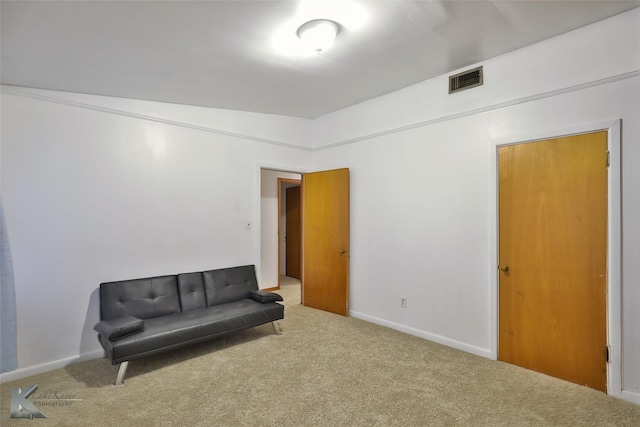 living area with carpet flooring and vaulted ceiling