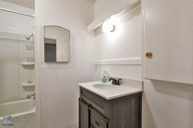 bathroom with shower / tub combination and vanity