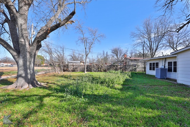 view of yard with central AC unit