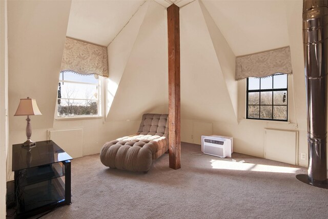 sitting room with lofted ceiling, a wall mounted air conditioner, and carpet floors