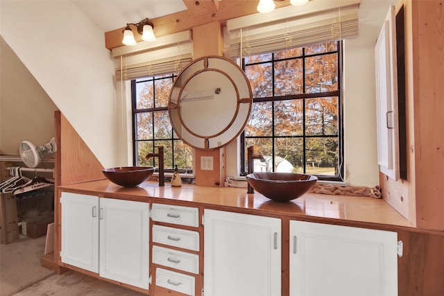 bar featuring white cabinetry