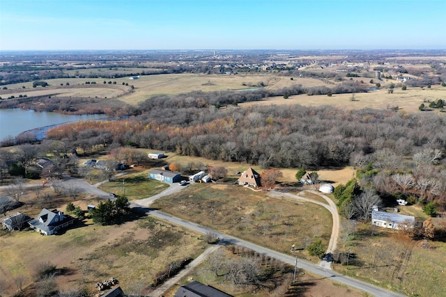 birds eye view of property featuring a water view and a rural view